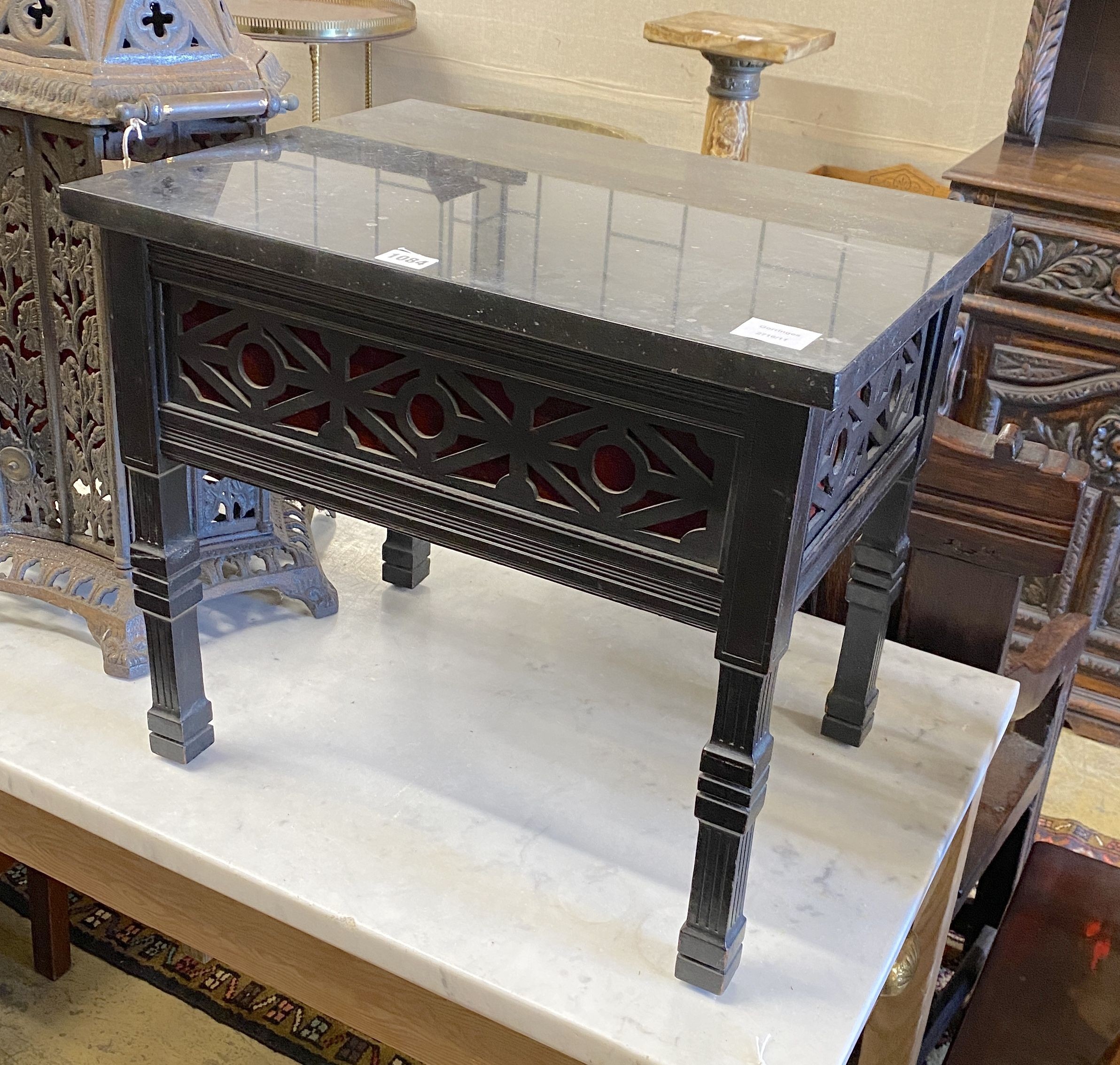 A late Victorian fret cut ebonised marble-topped occasional table, adapted, width 52cm, depth 40cm, height 45cm